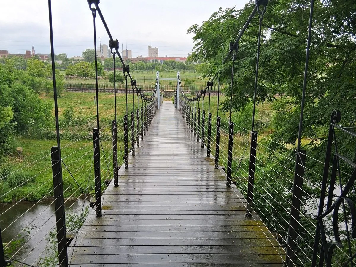 Suspension footbridge with the Rockford skyline in Rockford, Illinois